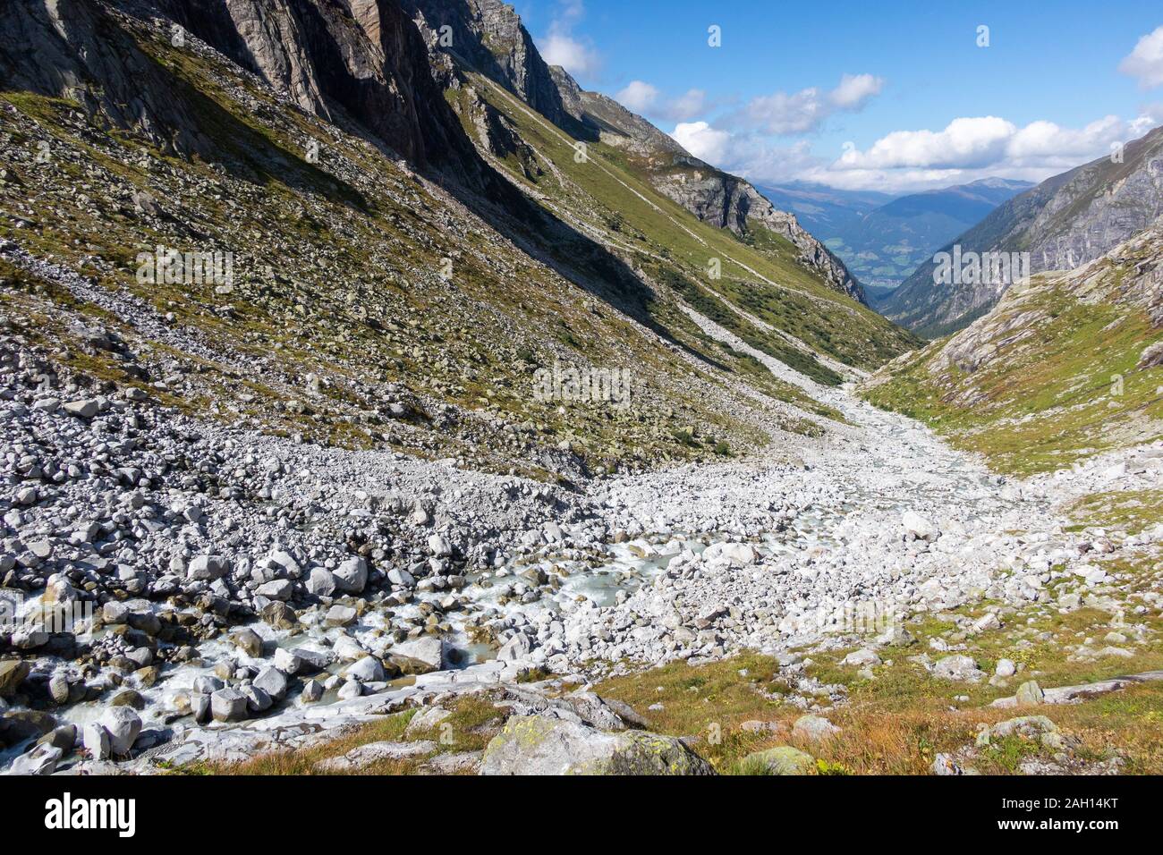 Alpine torrent, stones and rocks. View of Untersulzbach valley. Venediger group. Glacial alpine valley. Hohe Tauern National Park. Austrian Alps. Stock Photo