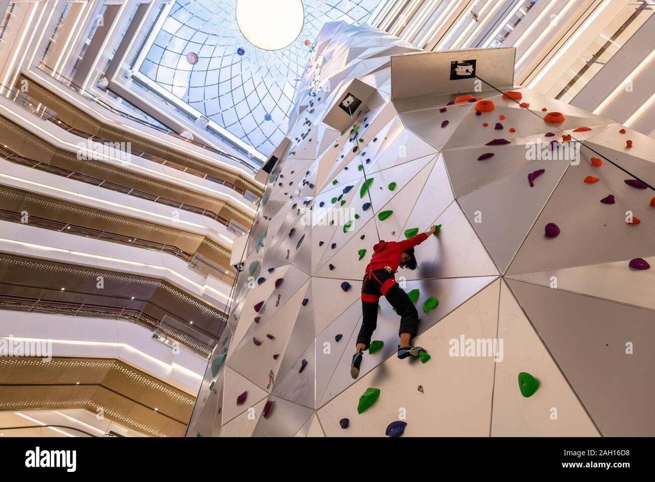 A young woman tries out the 55metertall world's tallest indoor roket