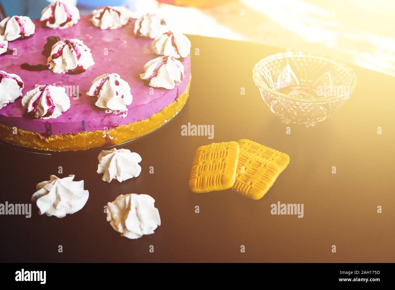 Blueberry cake with biscuits and cookies on the black table Stock Photo