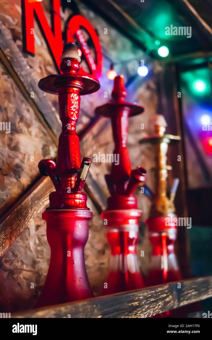 three hookahs on the shelf under the inscription not to smoke Stock Photo