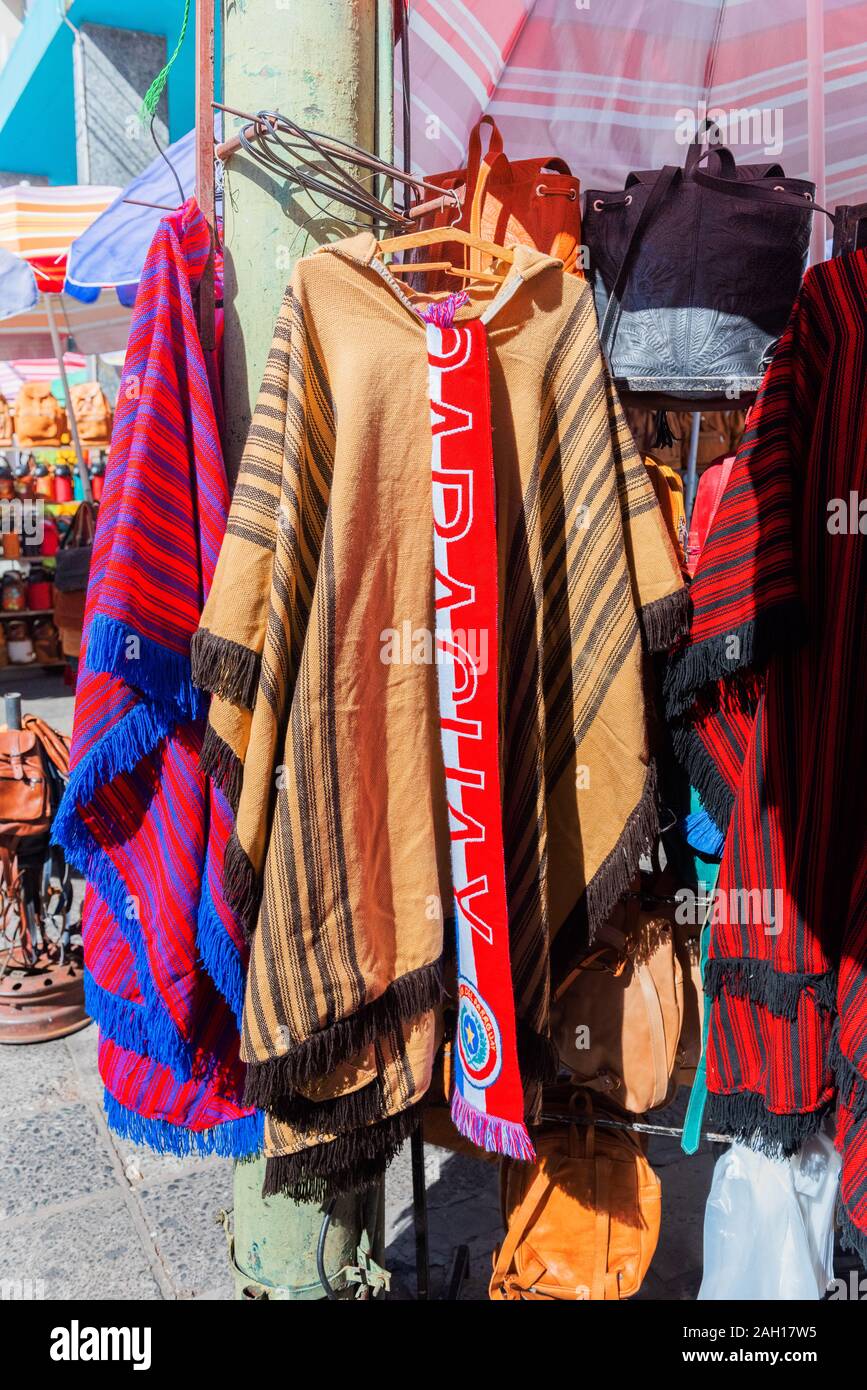 ASUNCION, PARAGUAY - JUNE 24, 2019: Selling poncho in the local market.  Vertical Stock Photo - Alamy
