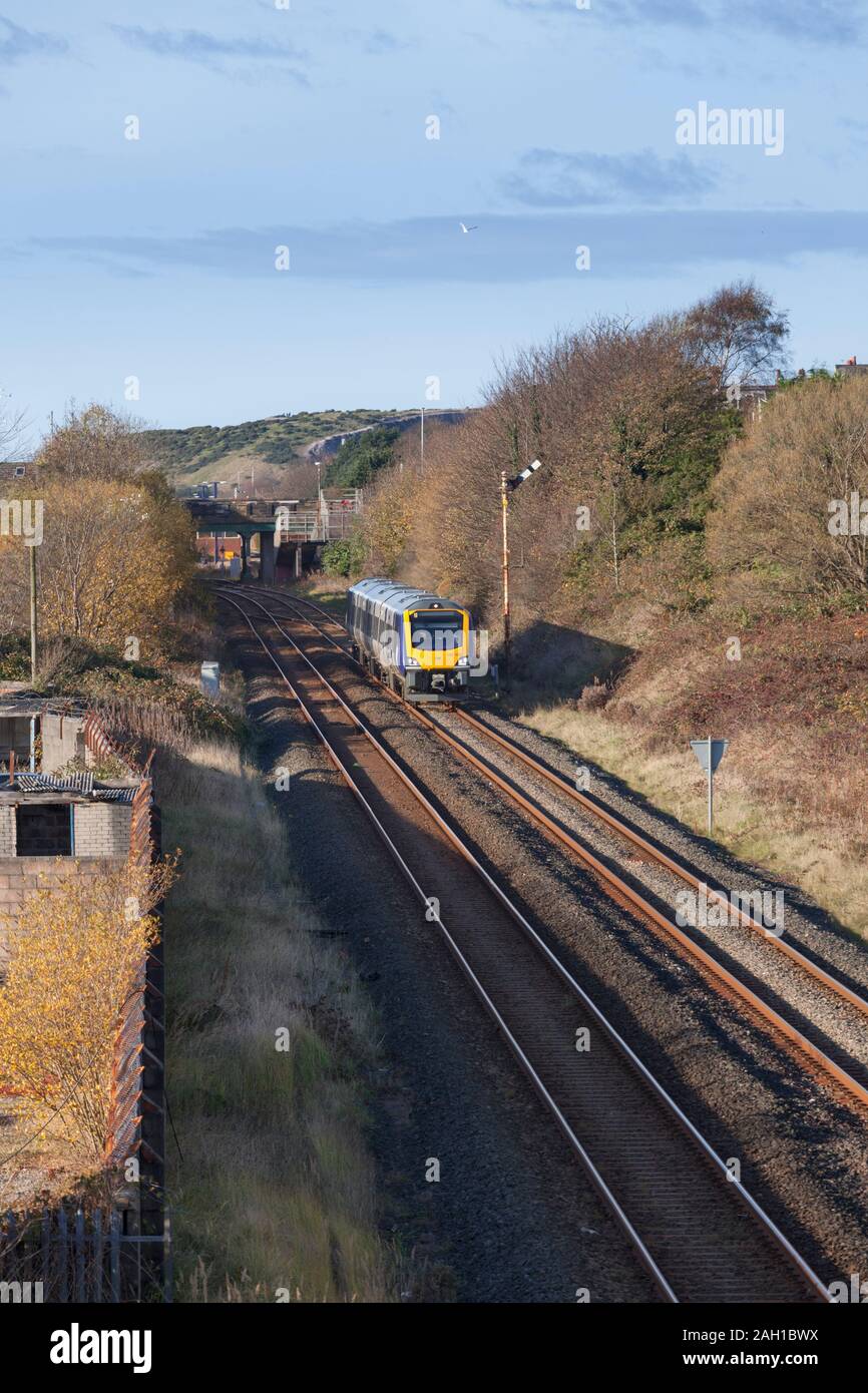 Arriva Northern rail CAF class 195 train departing from Barrow In