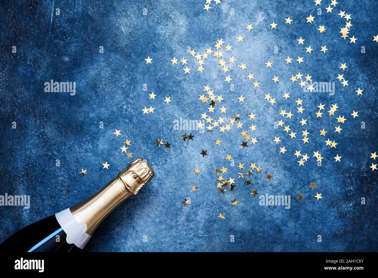Champagne Bottle And Confetti Stars On Classic Blue Background Christmas Birthday Carnival Or Wedding Concept Flat Lay Style Copy Space For Text Stock Photo Alamy Champagne Bottle And Confetti Stars On Classic Blue Background Christmas Birthday Carnival Or Wedding Concept Flat Lay Style Copy Space For Text Stock Photo Alamy