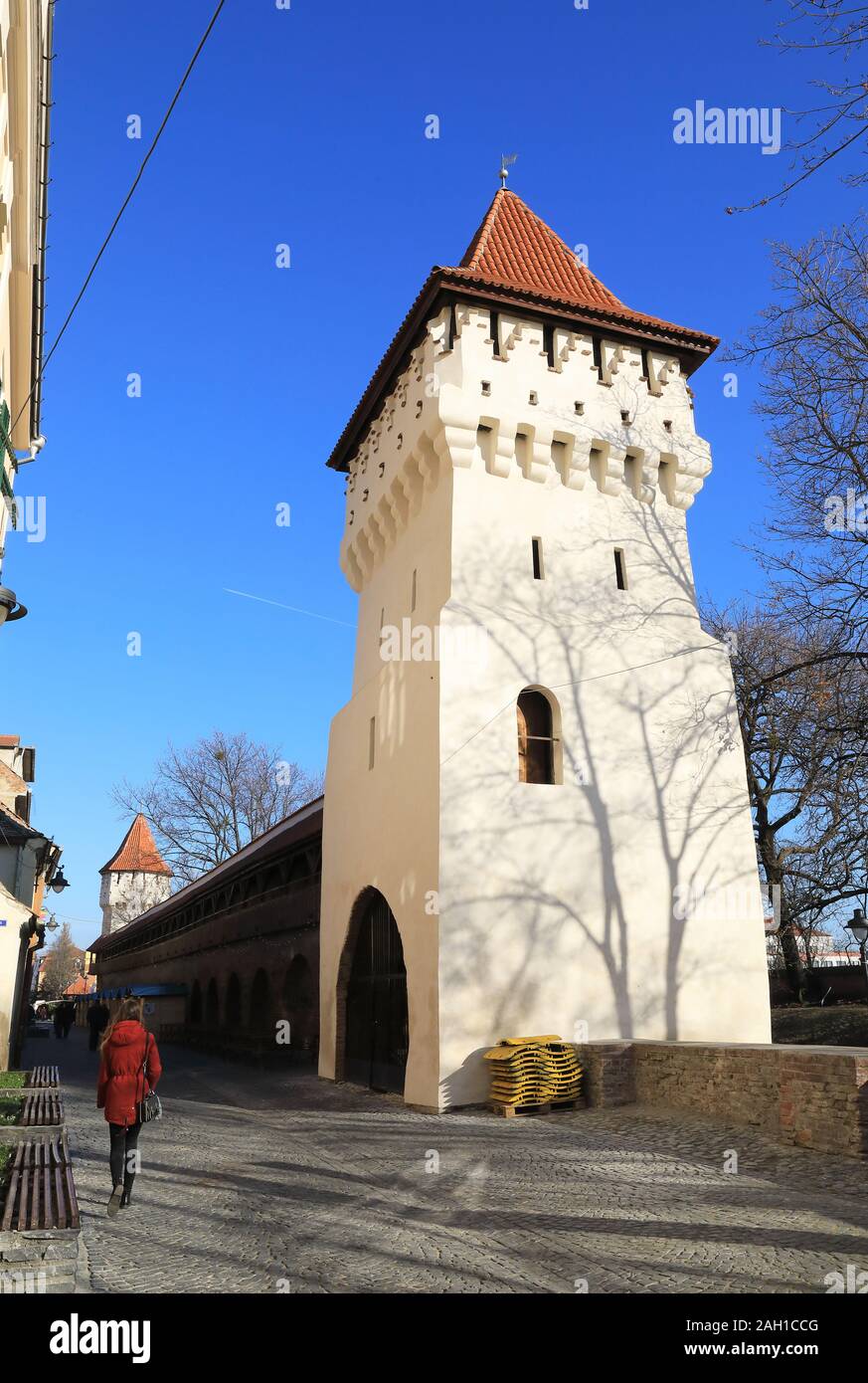 Winter sunshine on the medieval Potters Tower in the City Wall in Sibiu's Old Town, in Transylvania, Romania Stock Photo