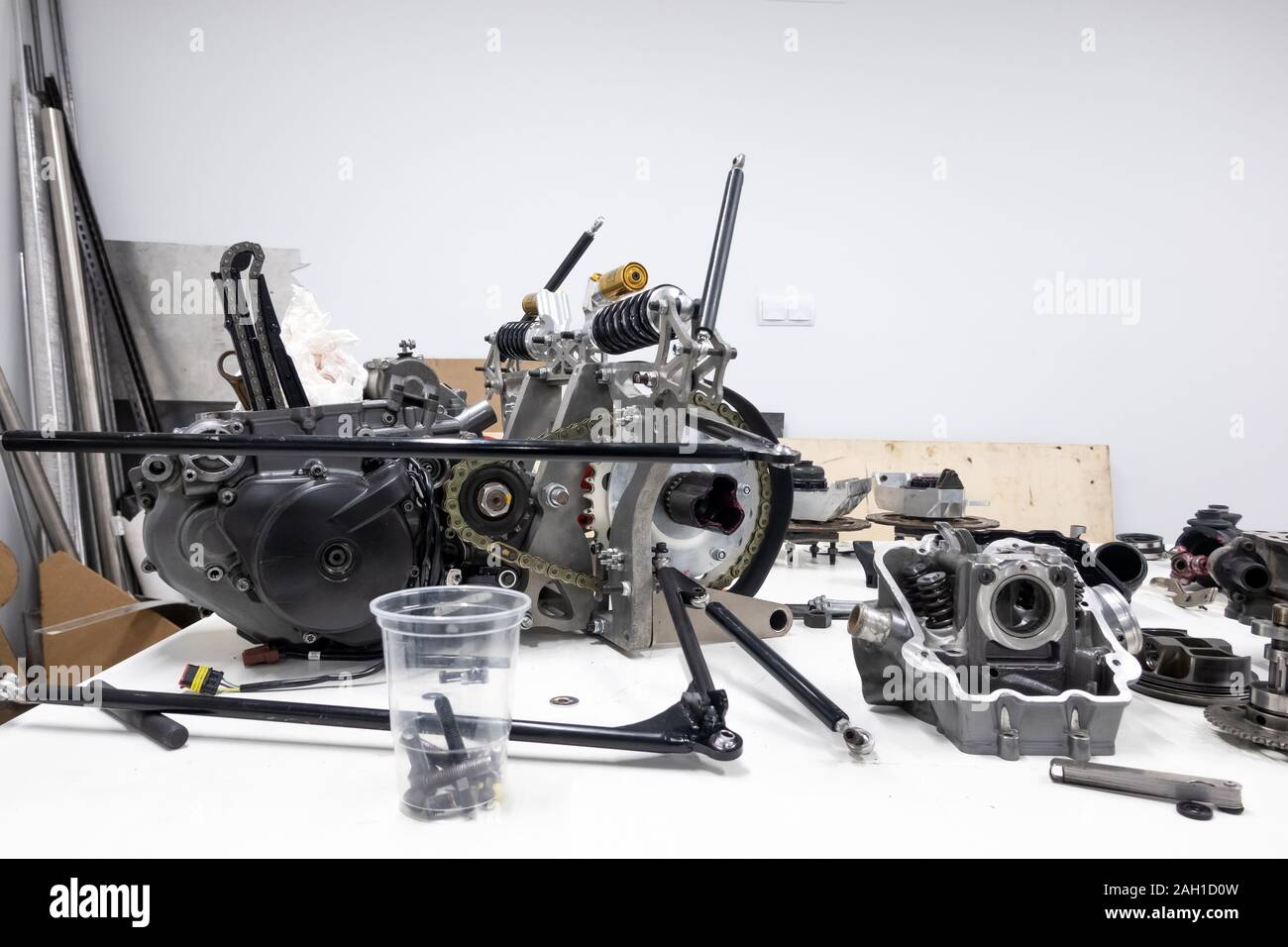 Sports car engine parts on the table. Assembling of vehicle engine. Car