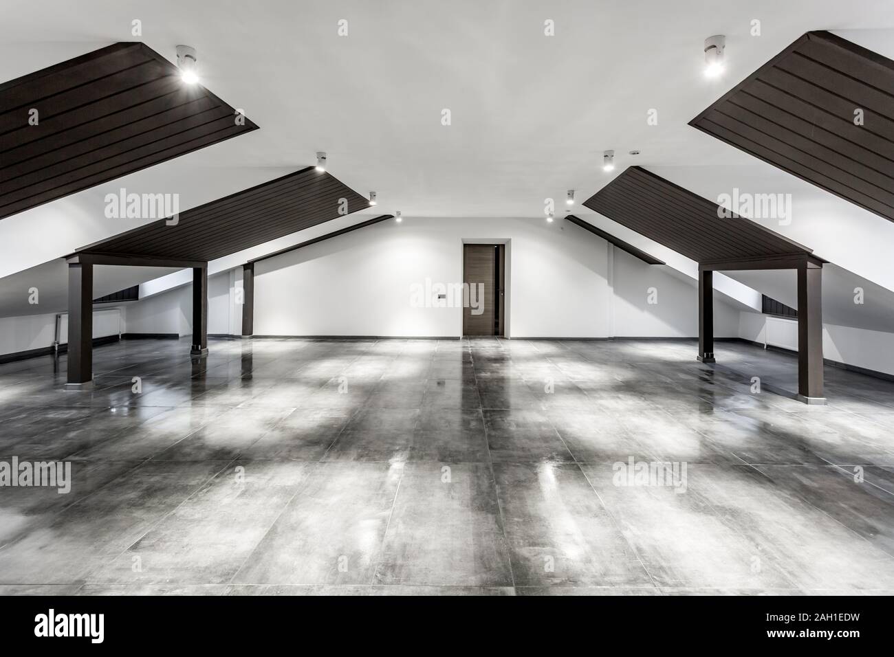 Empty Unfurnished Loft Mansard Room Interior With Wooden Columns
