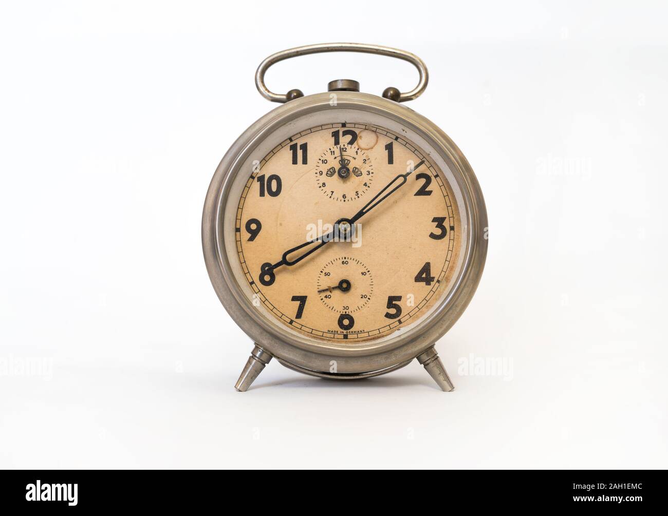 Vintage alarm clock isolated on white background Stock Photo - Alamy