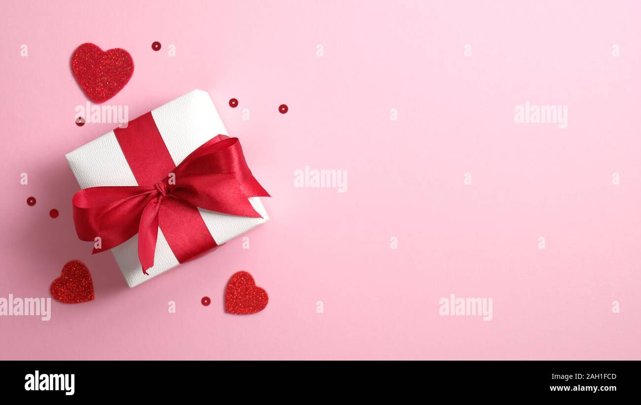 Download White Paper Gift Box With Red Ribbon Bow On Pink Background With Valentines Hearts Flat Lay Top View Copy Space Banner Or Greeting Card Mockup For Stock Photo Alamy PSD Mockup Templates