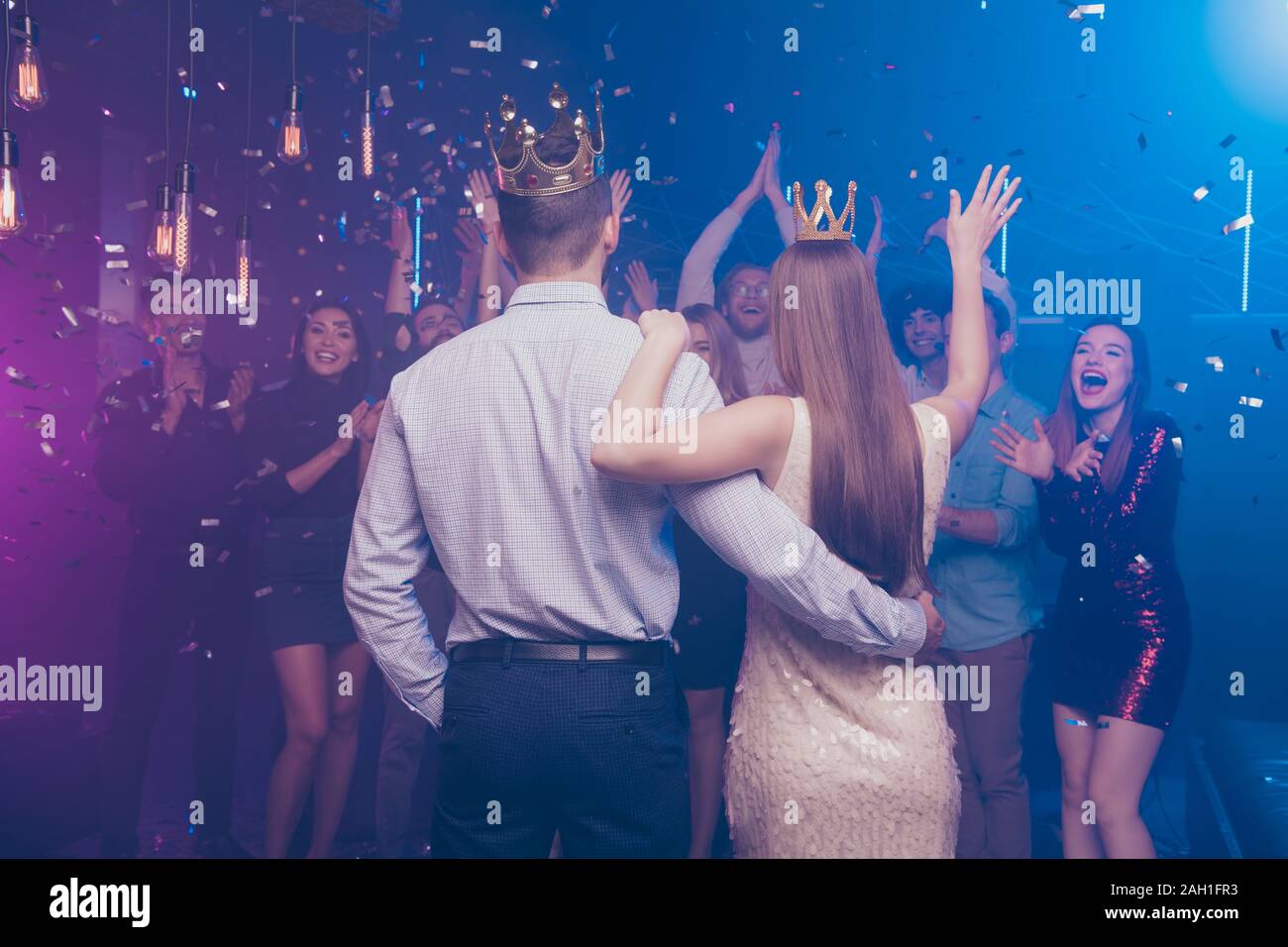 Back side view portrait of lovers have become king queen celebrating scream buddies enjoy dance floor Stock Photo