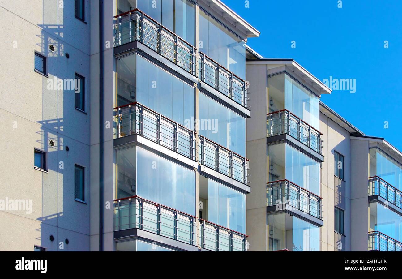 Balconies in apartment residential building with reflex Stock Photo - Alamy