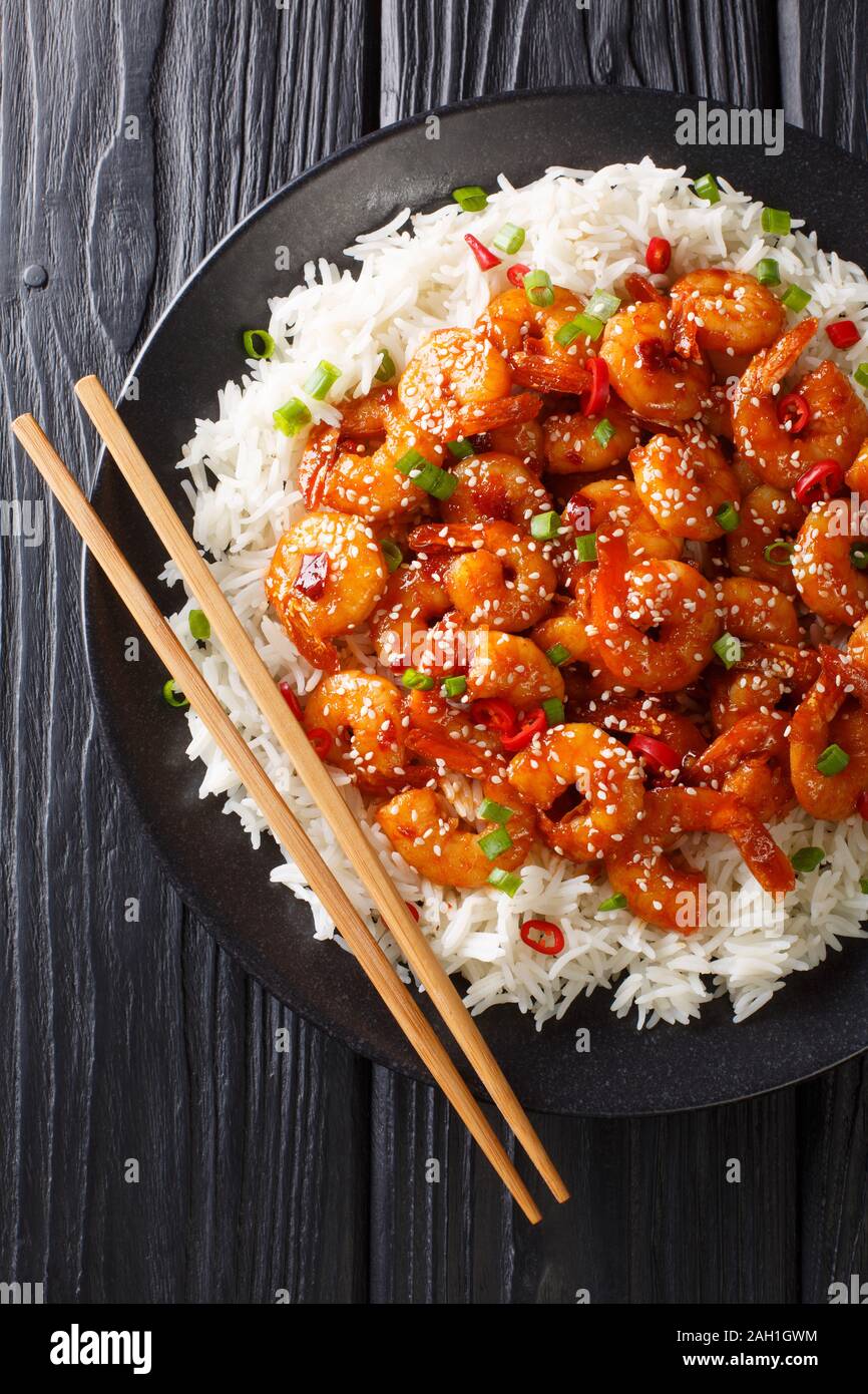 Asian Chilli Garlic Prawns Shrimp with rice side dish closeup in a