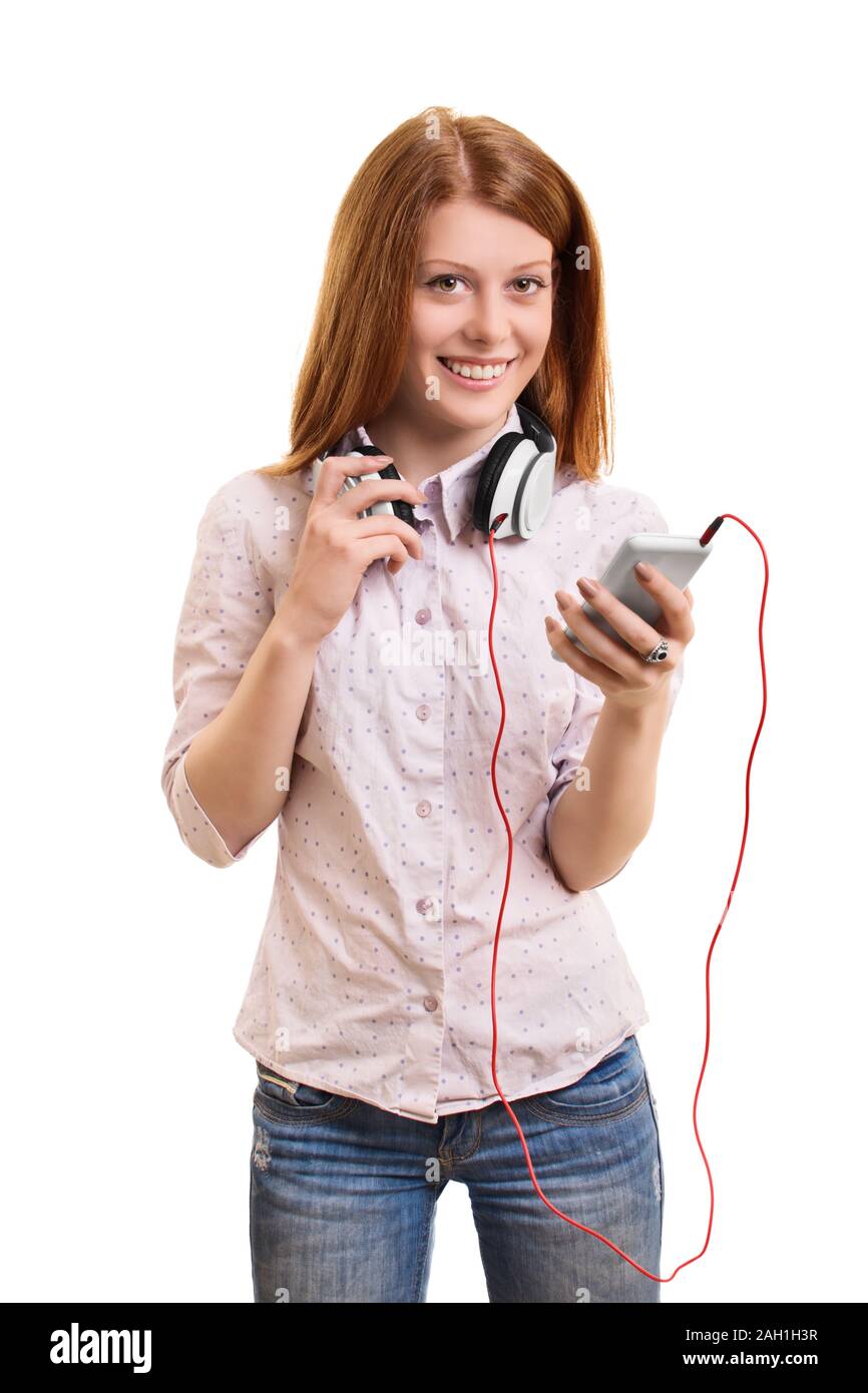Portrait of a beautiful young girl with headphones around her neck