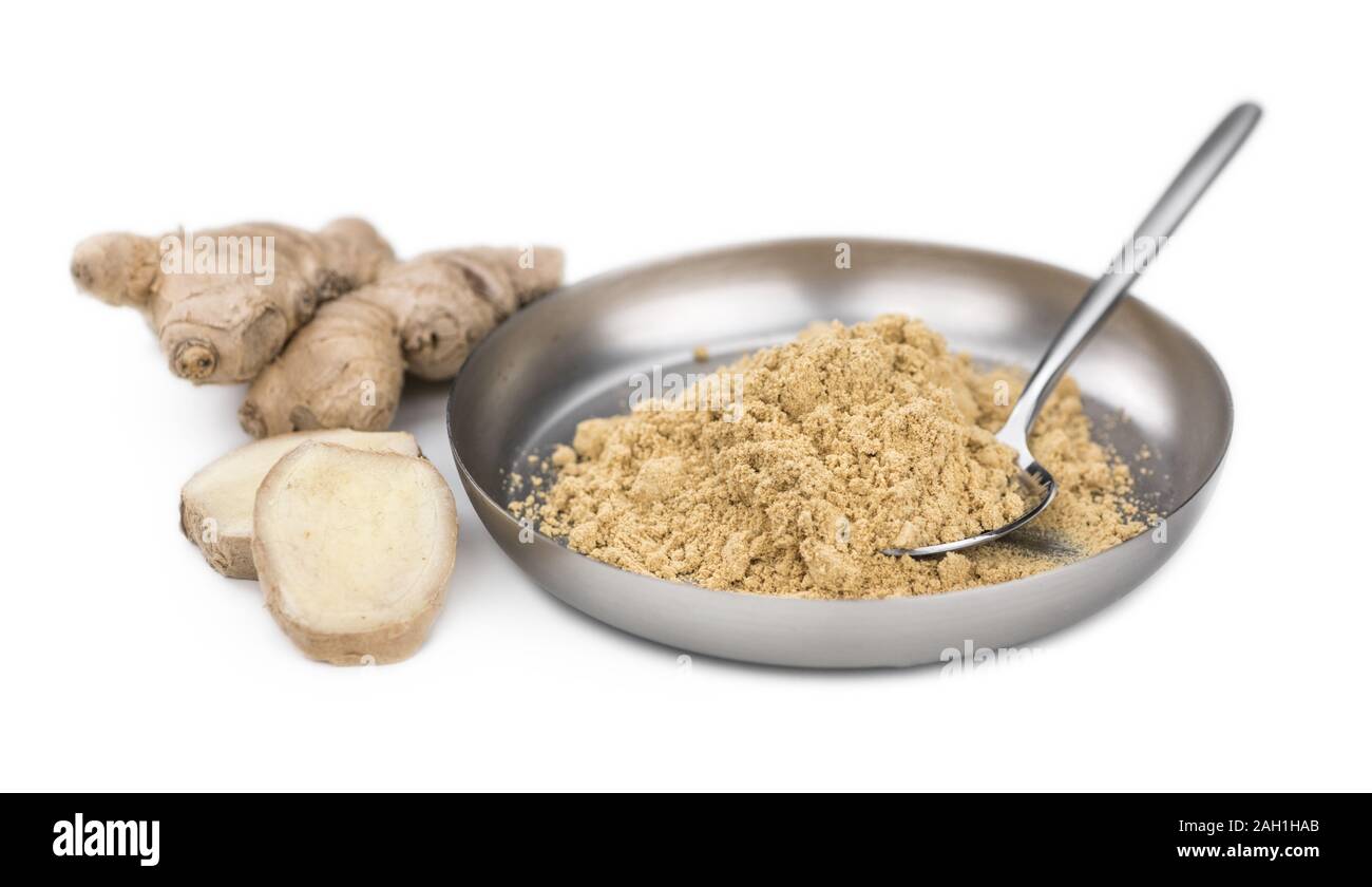 Some Powdered Ginger isolated on white (selective focus) Stock Photo