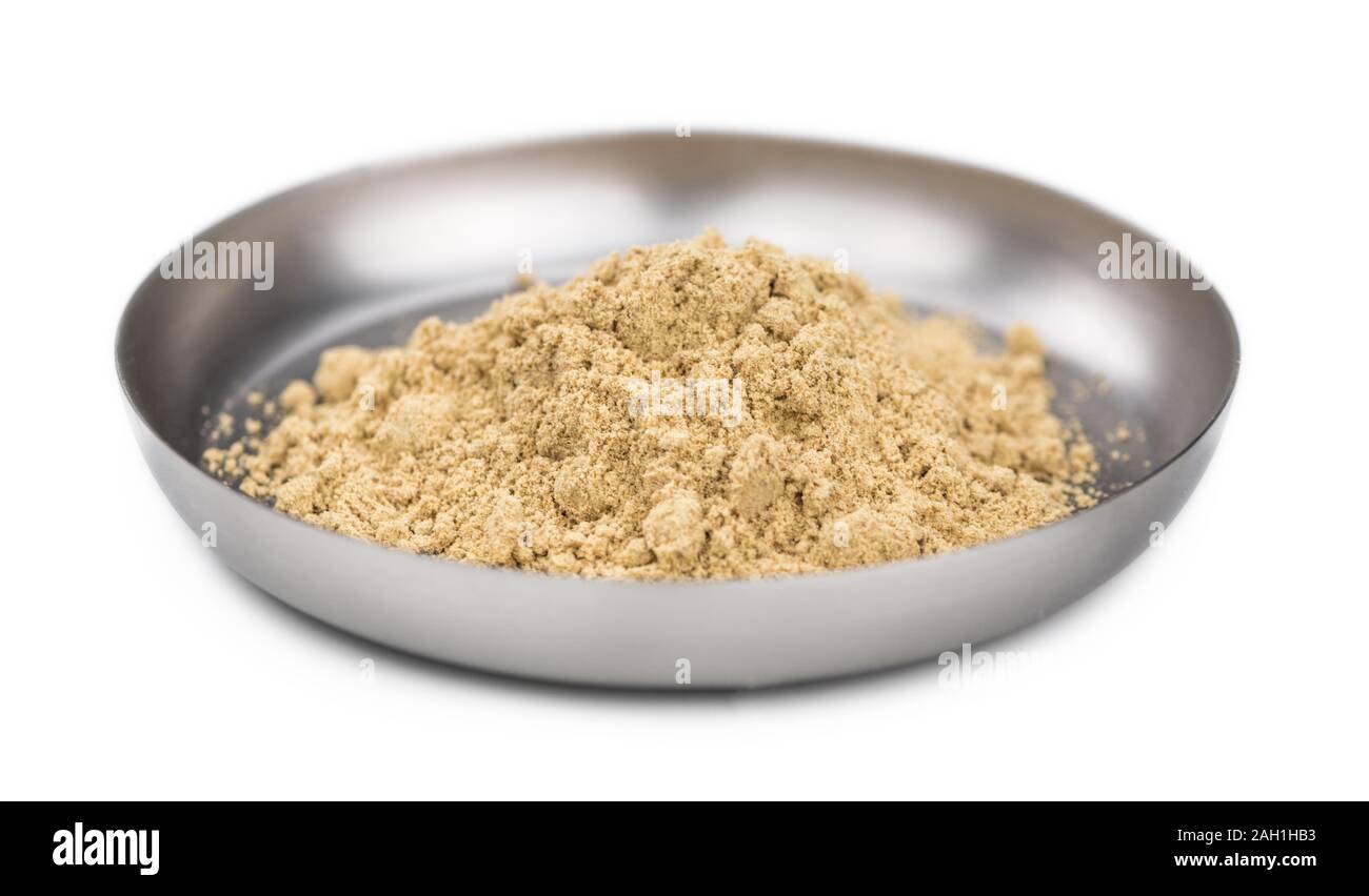 Some Powdered Ginger isolated on white (selective focus) Stock Photo