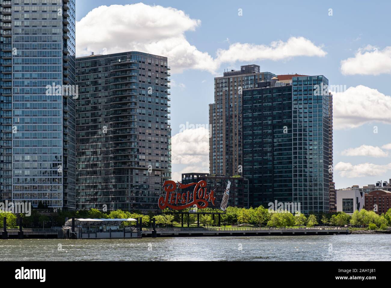 New York City - USA - May 15 2019: Long Island City apartment buildings with Pepsi Cola sign view from Roosevelt Island Stock Photo