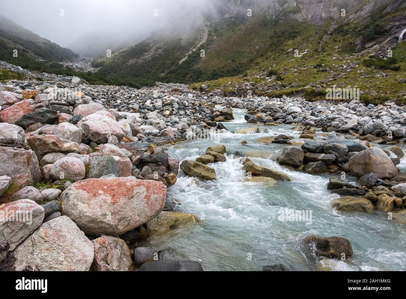 Alpine torrent, stones and rocks. Geology of Untersulzbach valley. Venediger group. Glacial alpine valley. Hohe Tauern National Park. Austrian Alps. Stock Photo