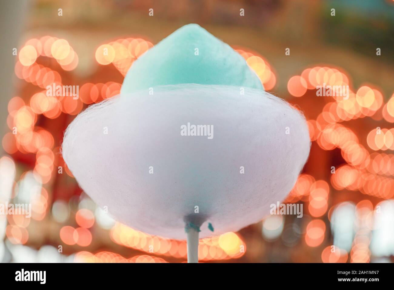 The hands of women holding blue cotton candy Stock Photo