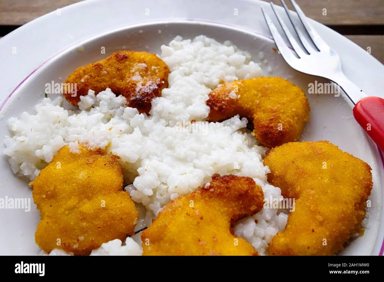 Cooked Breaded chicken nuggets with Rice Stock Photo Alamy
