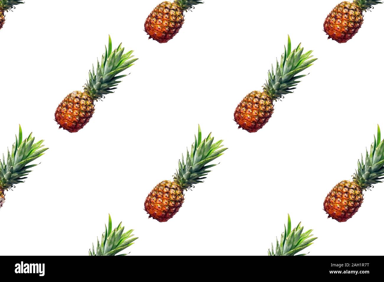 Creative food pattern with pineapples on white background Stock Photo