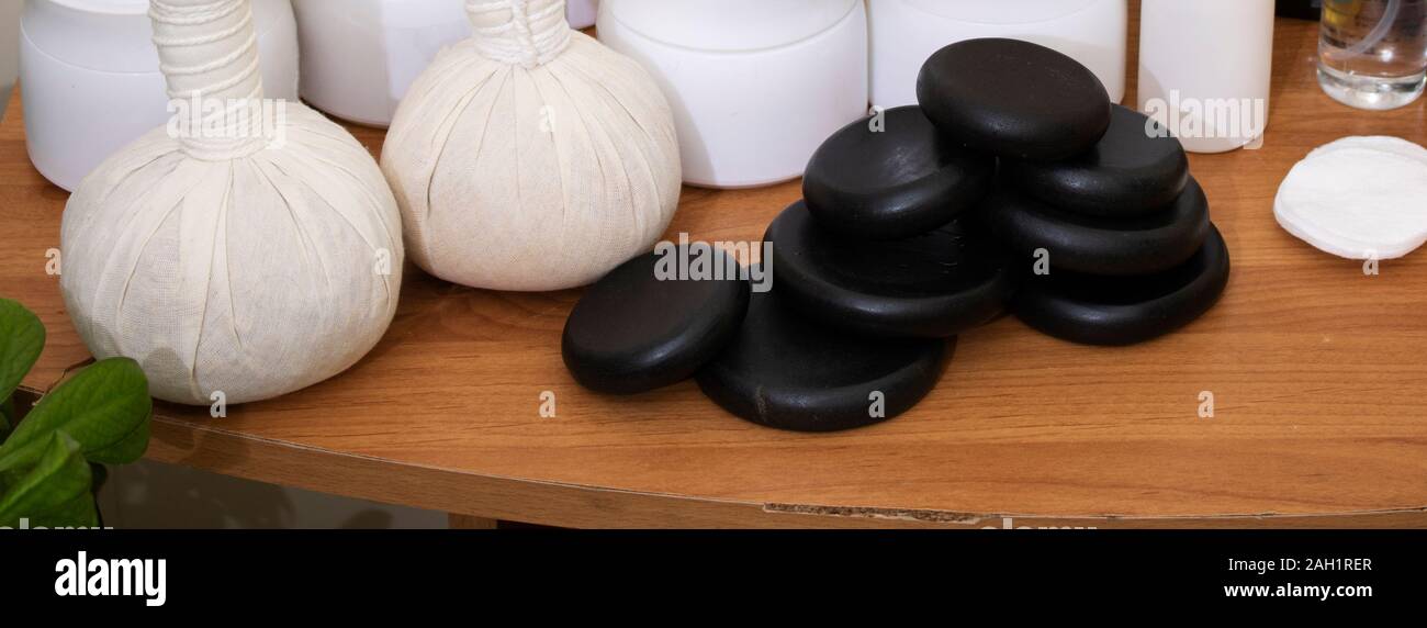 spa frame from bamboo grove, black zen stones on the old wooden background Stock Photo