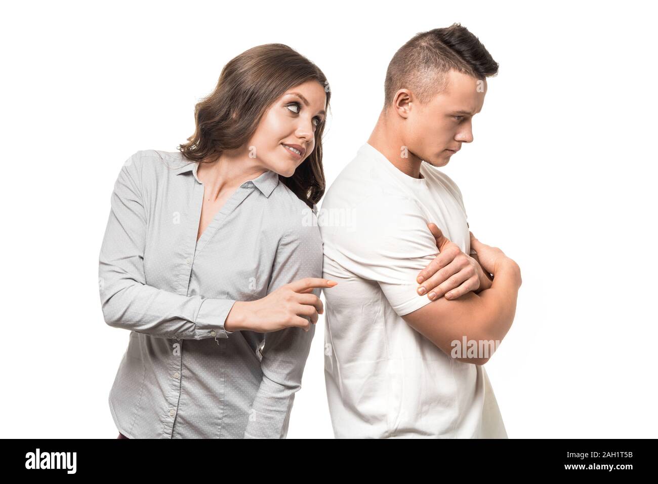 Portrait of calm woman embracing caucasian man. Woman touching her husband for reconciliation. Love and family support concept. Stock Photo