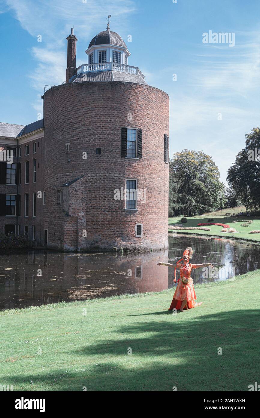 Rozendaal, Netherlands, 25 August 2019:  Visual artist performs at the rear of the Rosendael castle Stock Photo