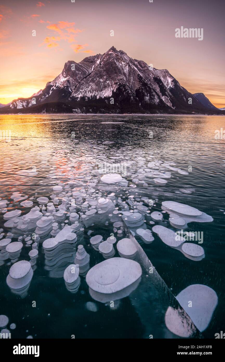 Methane bubbles trapped in frozen lake of Abraham Lake,  Alberta, BC, Canada, Stock Photo