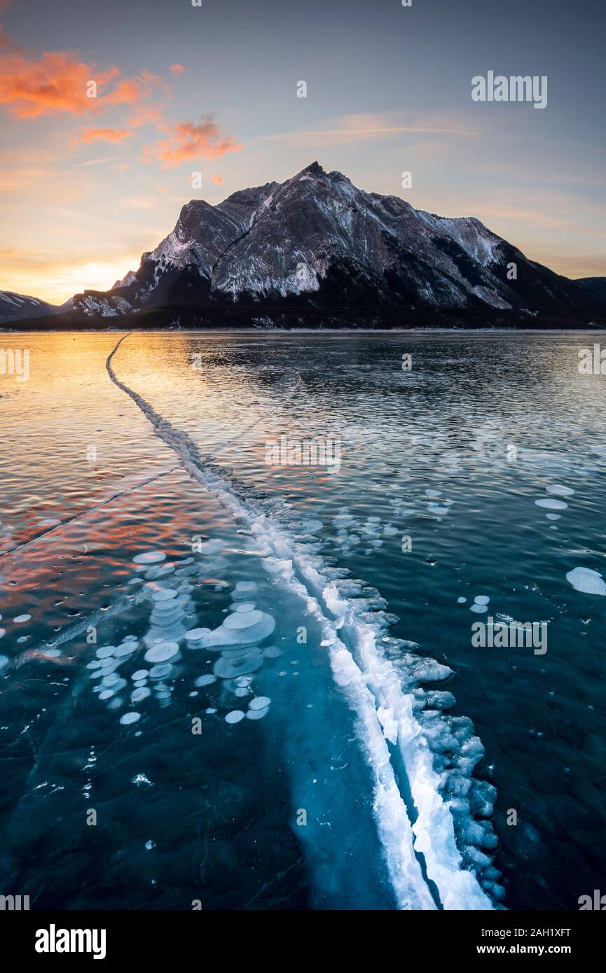 Ice cracks at Abraham Lake,  Alberta, BC, Canada, Stock Photo