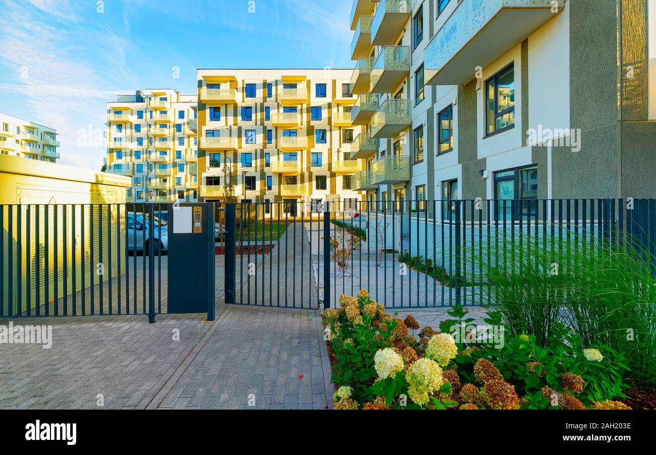 Modern new residential apartment house building with entrance gate