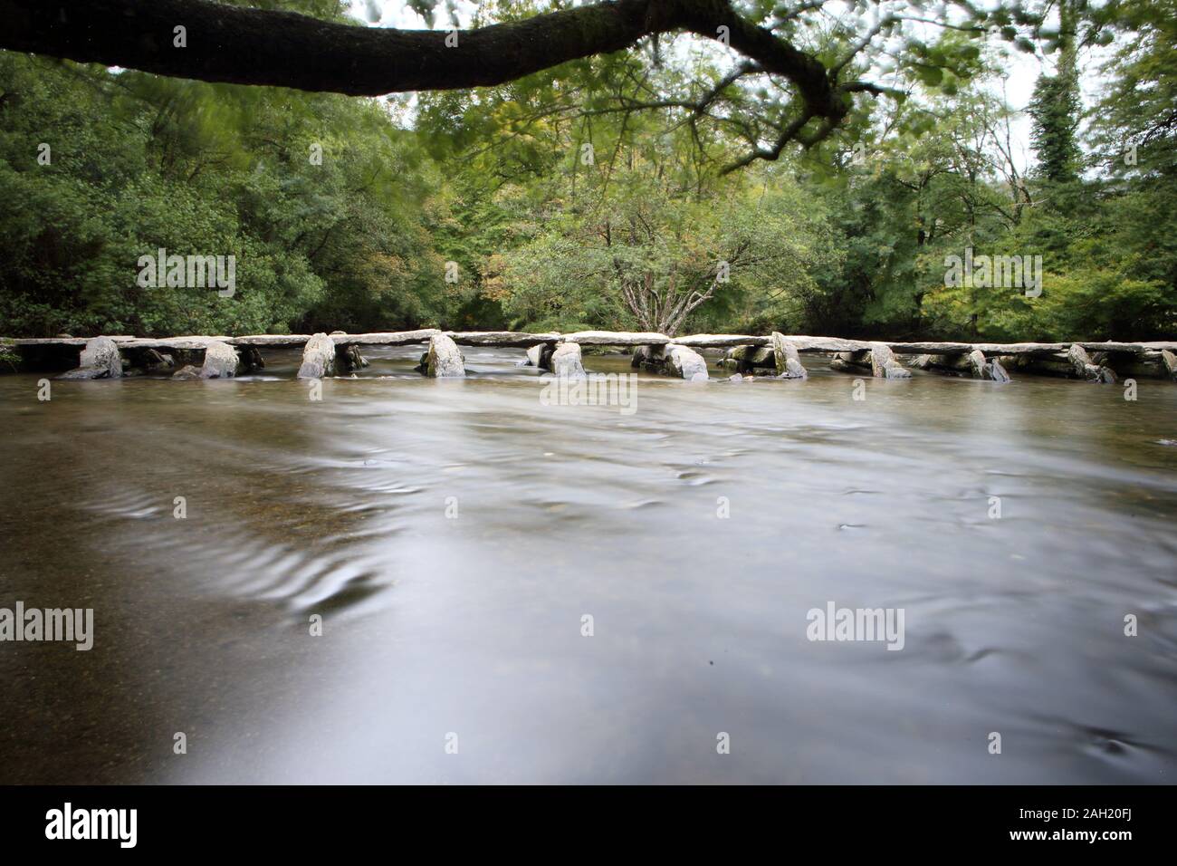 Tarr Steps - clapper bridge over River Barle, Exmoor in Somerset. UK Stock Photo