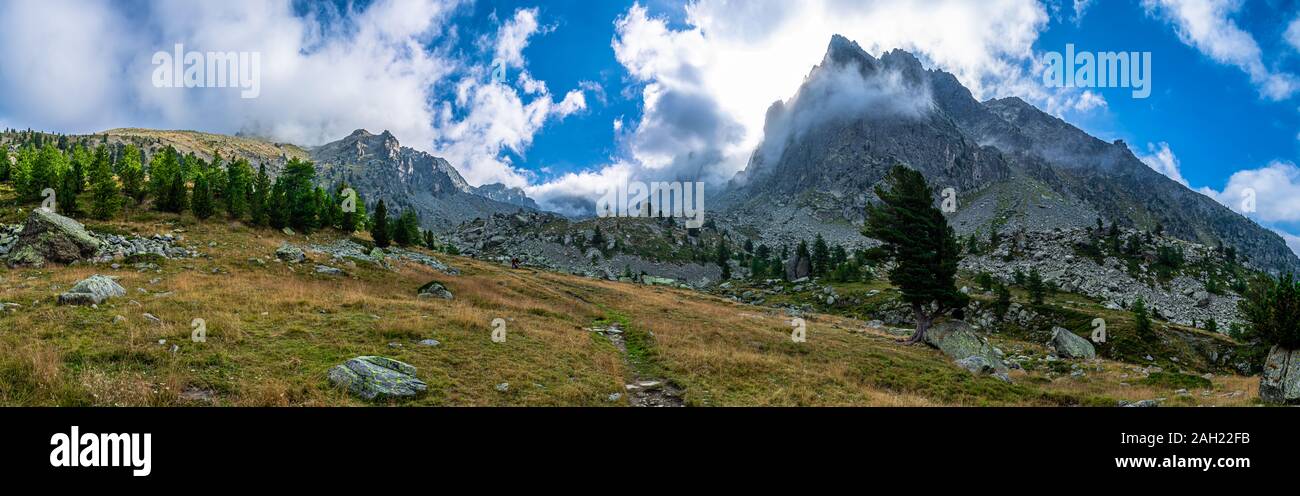 Hiking around Monviso: unique scenarios, mountains and enchanting landscapes, suggestive sunrise and sunset Stock Photo