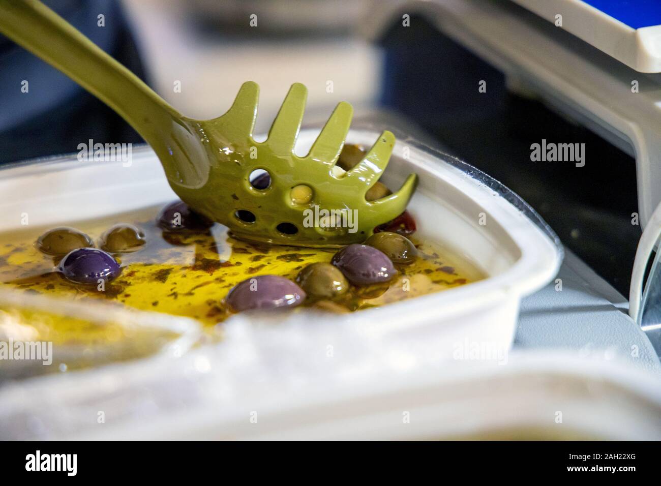 Big green olives in brine. Stock Photo