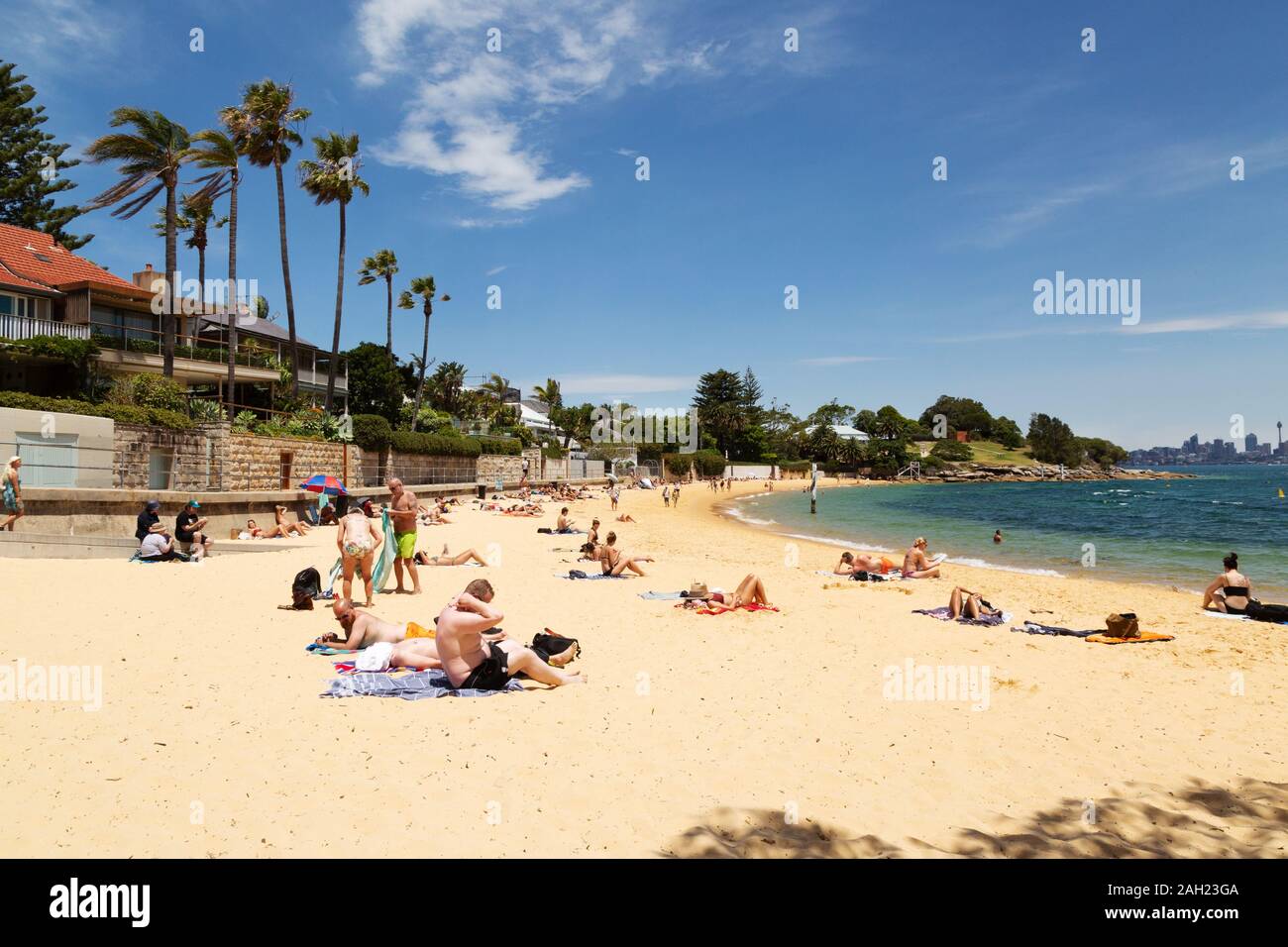 People sunbathing on Camp Cove beach on a sunny November day in spring, Camp Cove near Watsons Bay, Sydney Australia Stock Photo