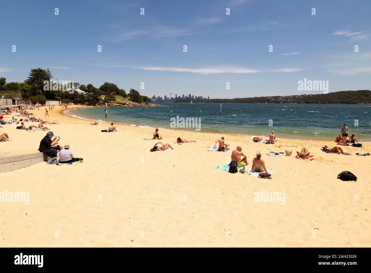 People sunbathing on Camp Cove beach on a sunny November day in spring, Camp Cove near Watsons Bay, Sydney Australia Stock Photo