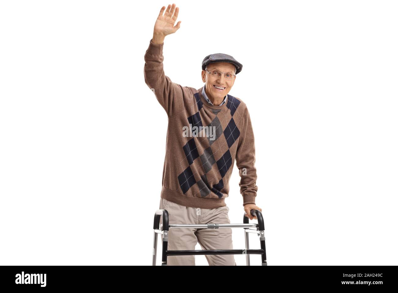 Senior man with a walker waving at the camera isolated on white ...