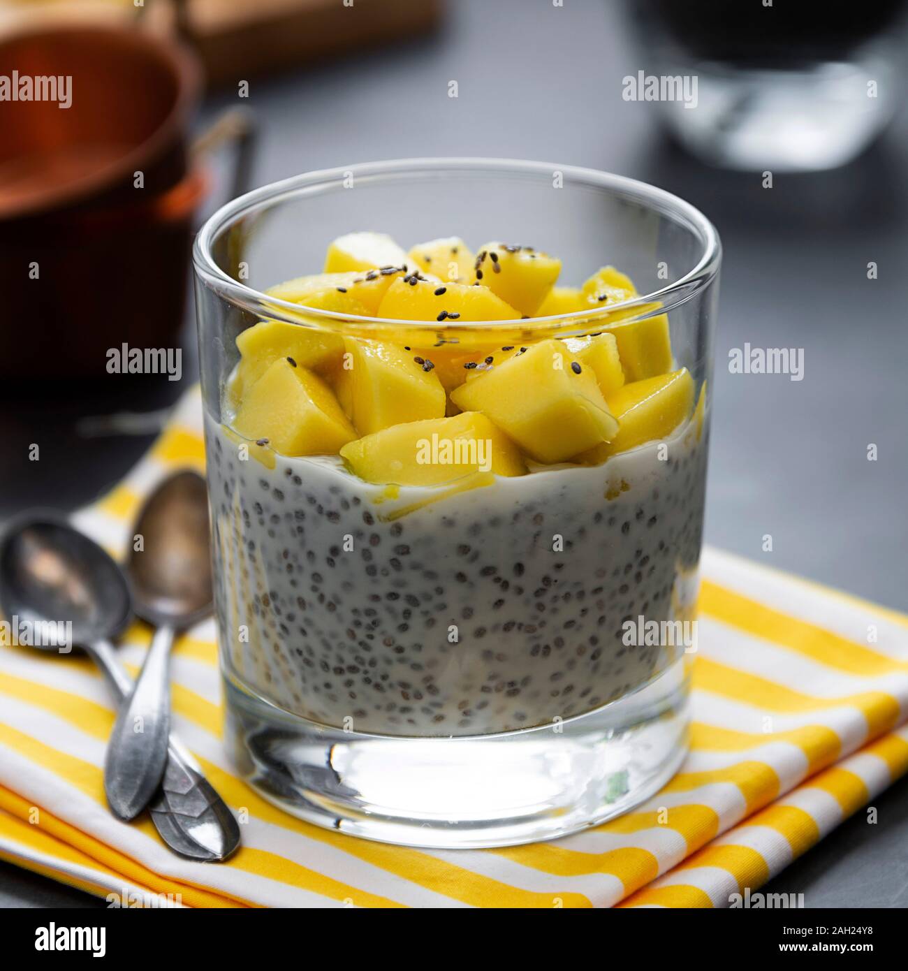 Coconut Chia seed pudding with pineapple, dark background copy space. Healthy food breakfast