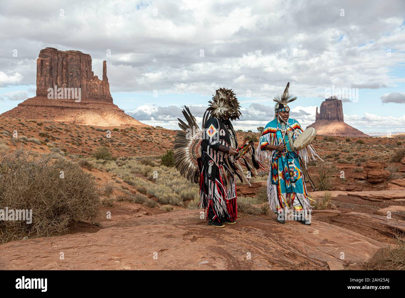 Navajo Dancers, West Mitten Butte (left) and East Mitten Butte in background, Monument Valley, Arizona and Utah border, USA Stock Photo