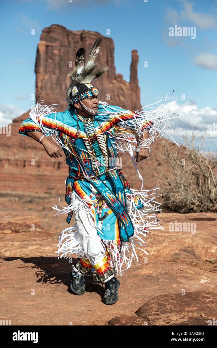 Navajo Dancer, West Mitten Butte in background, Monument Valley, Arizona and Utah border, USA Stock Photo