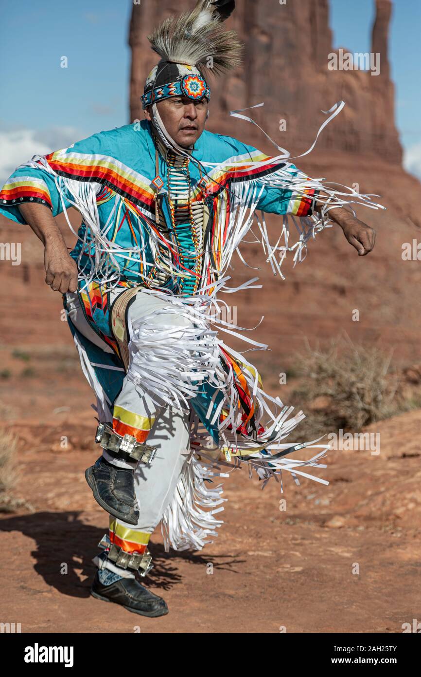 Navajo Dancer, West Mitten Butte in background, Monument Valley, Arizona and Utah border, USA Stock Photo