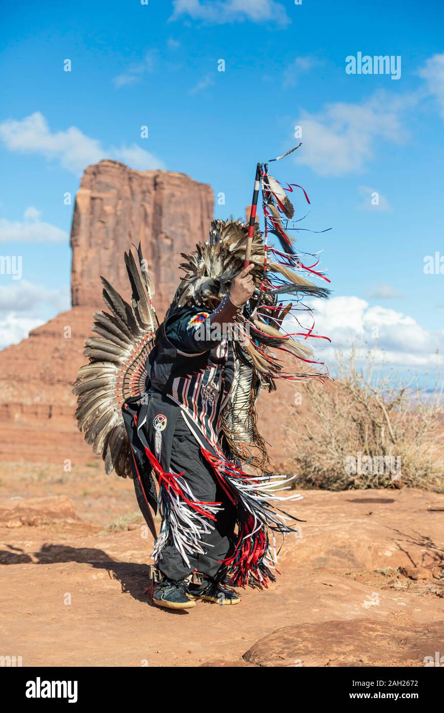 Navajo Dancer, West Mitten Butte in background, Monument Valley, Arizona and Utah border, USA Stock Photo