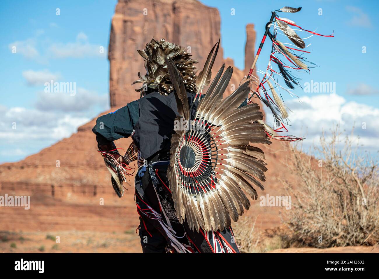 Navajo Dancer, West Mitten Butte in background, Monument Valley, Arizona and Utah border, USA Stock Photo