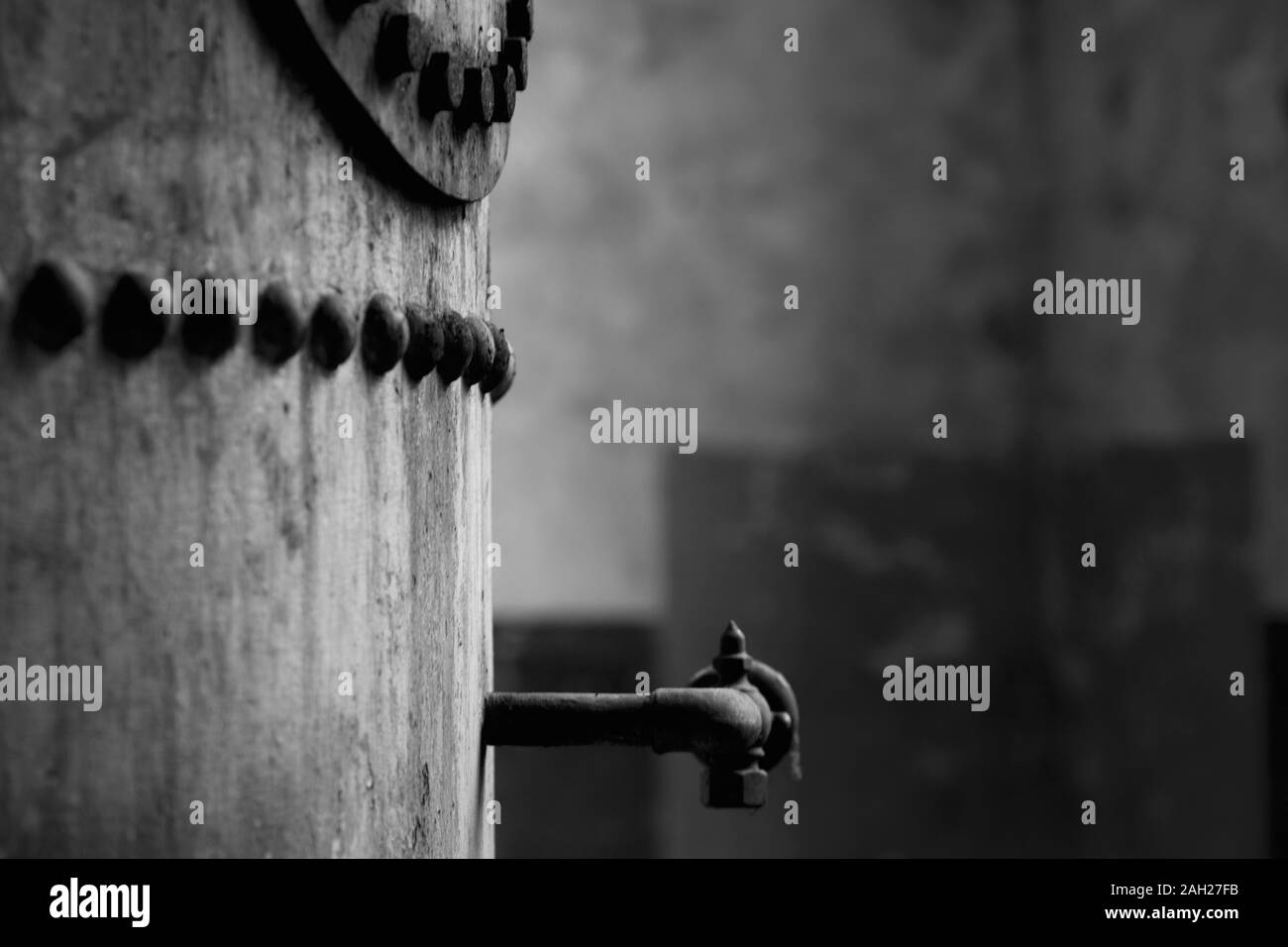 steam boiler with pop rivets and tap Stock Photo - Alamy