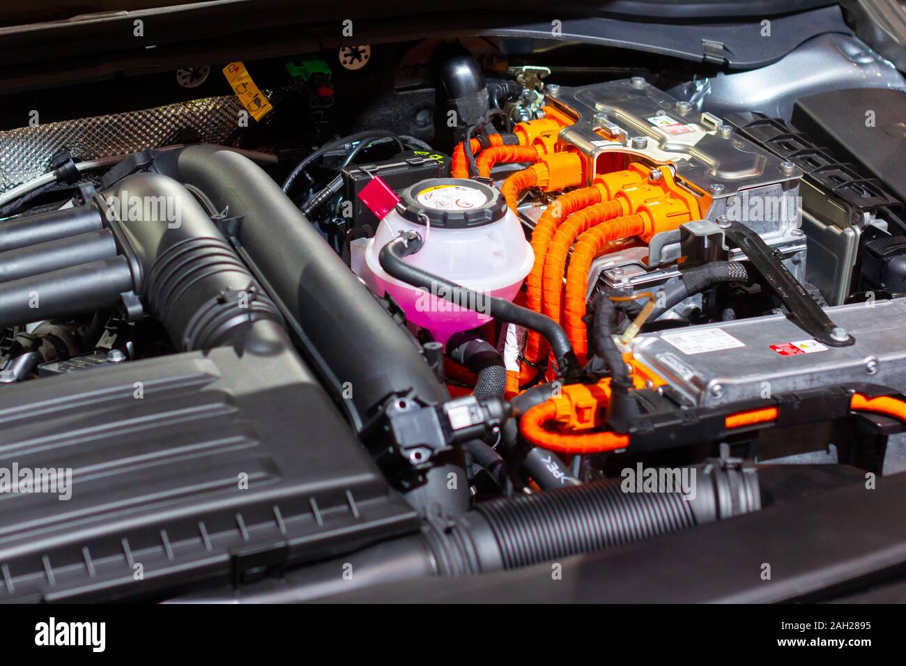 Under the hood of a hybrid or electric car. Detail of electric car engine. Stock Photo