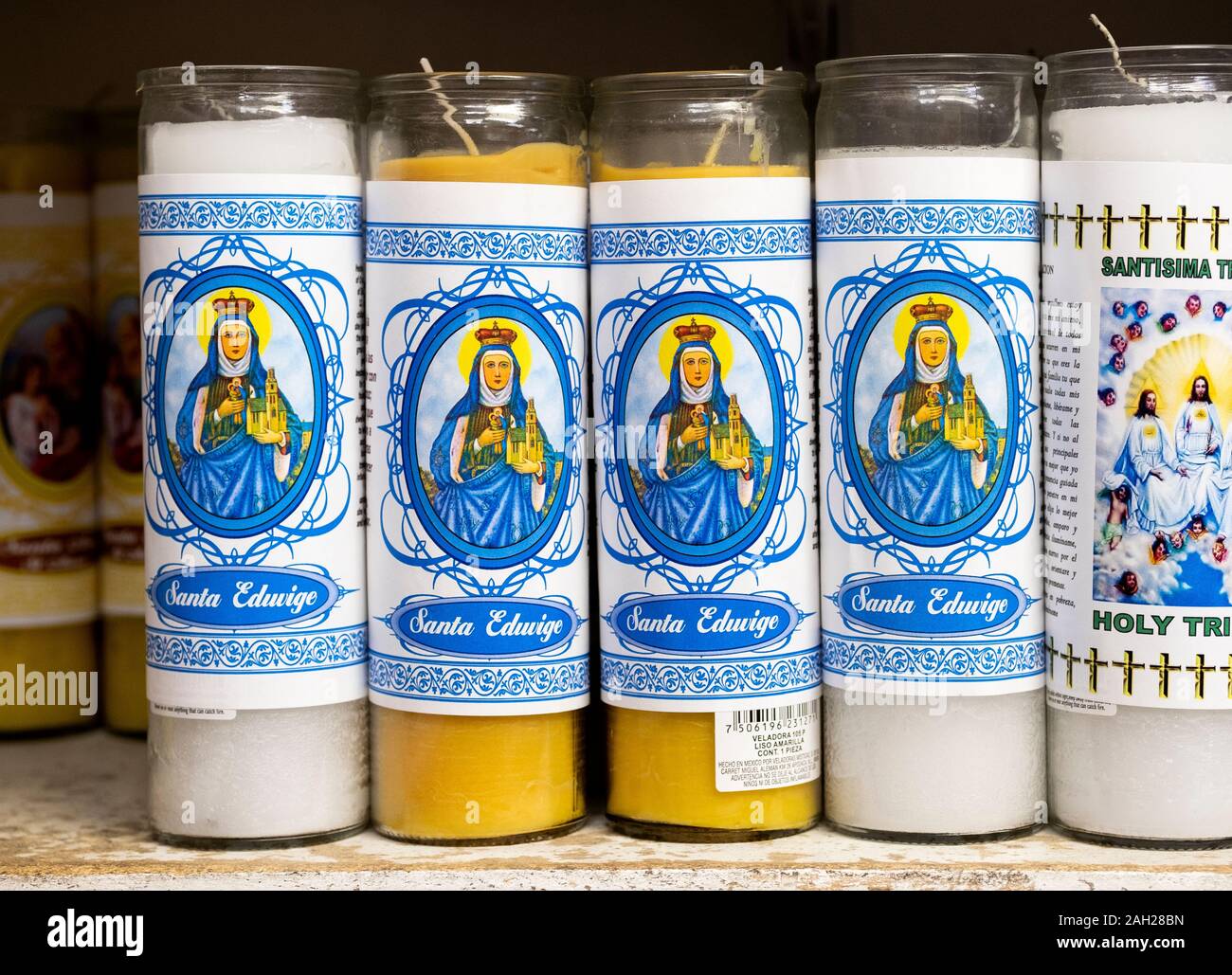 Spiritual religious scented candles for sale at Candalaria Botanica, a store selling religious items to the South American community. In Jackson Heigh Stock Photo