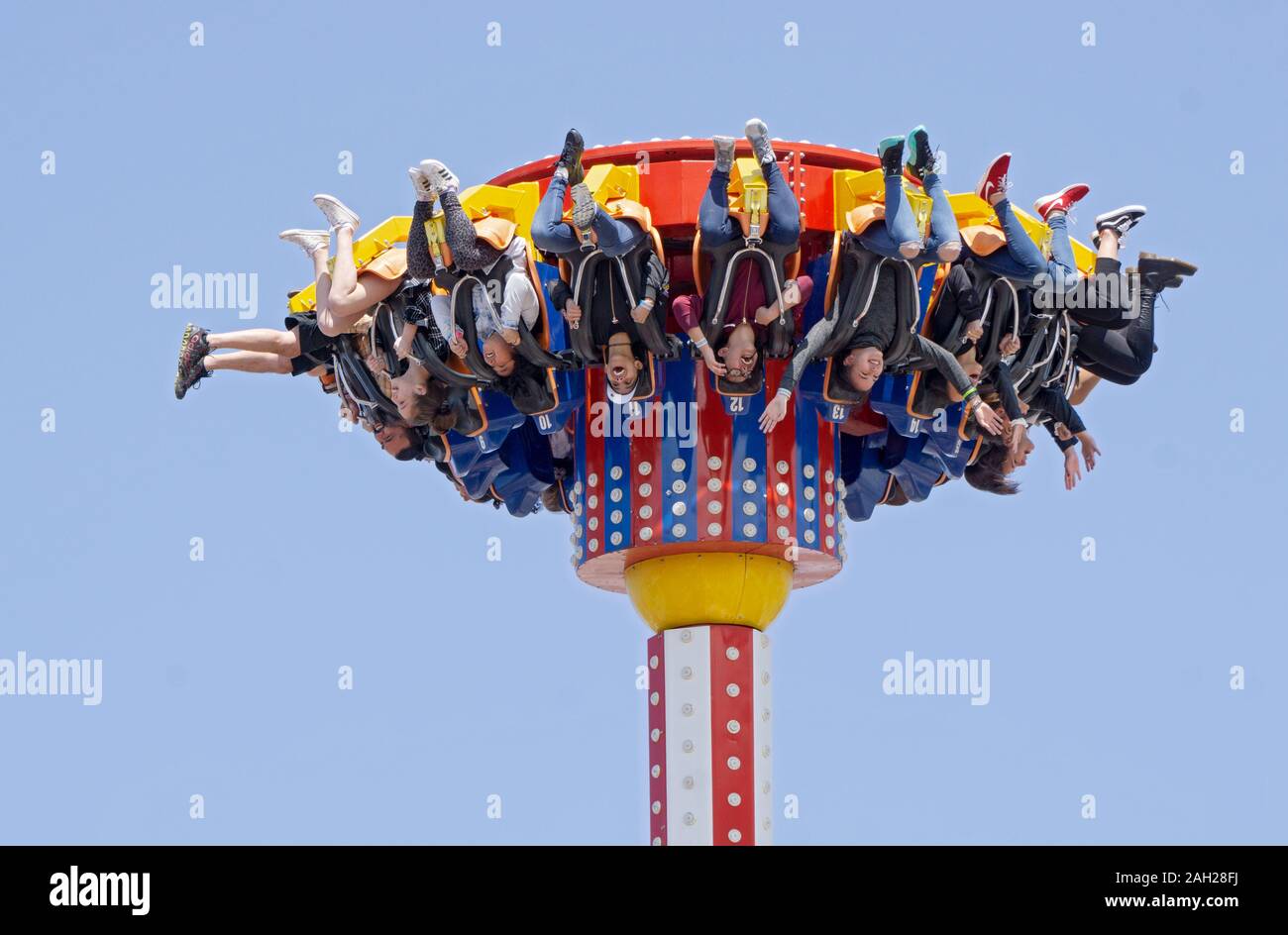 A diverse group of people on a scary ride in Luna Park, Coney Island, Brooklyn, New York City. Stock Photo