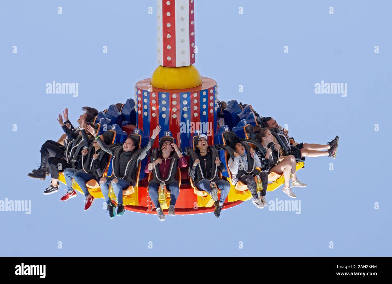 A diverse group of people on a scary ride in Luna Park, Coney Island, Brooklyn, New York City. Stock Photo