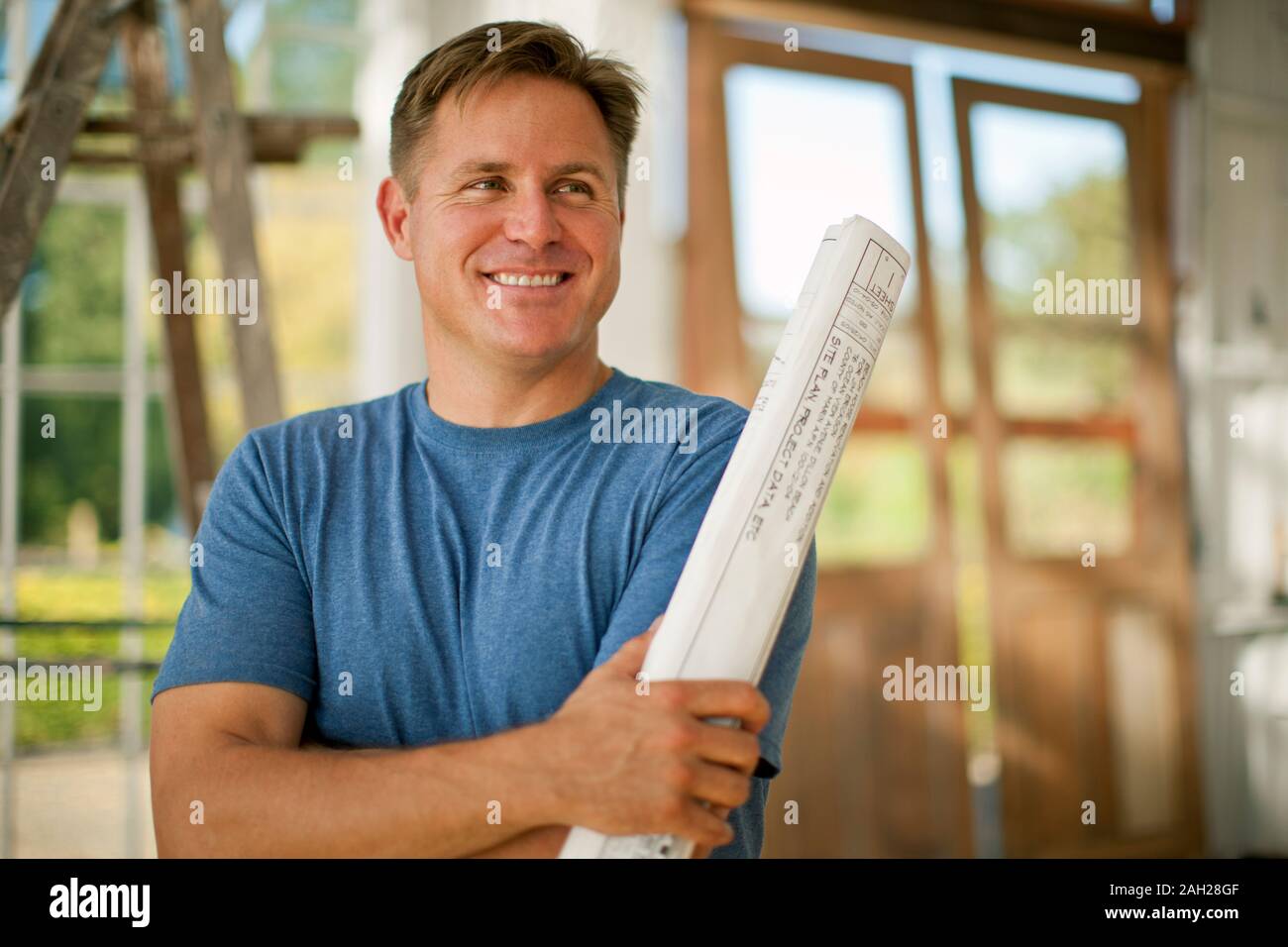 Two businessmen looking at samples on a construction site. Stock Photo