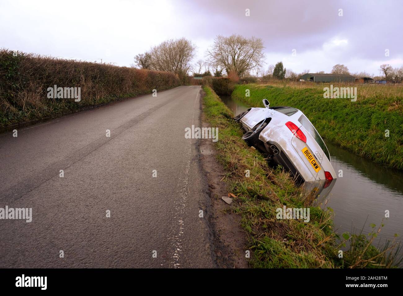 Christmas 2019 - White Audi A5 Saloon in a rural ditch at Christmas Stock Photo