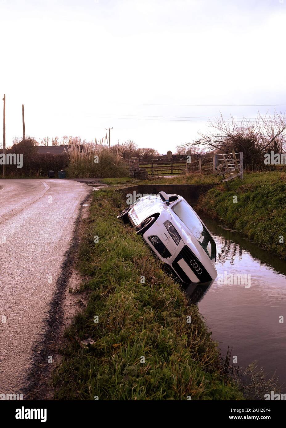 Christmas 2019 - White Audi A5 Saloon in a rural ditch at Christmas Stock Photo