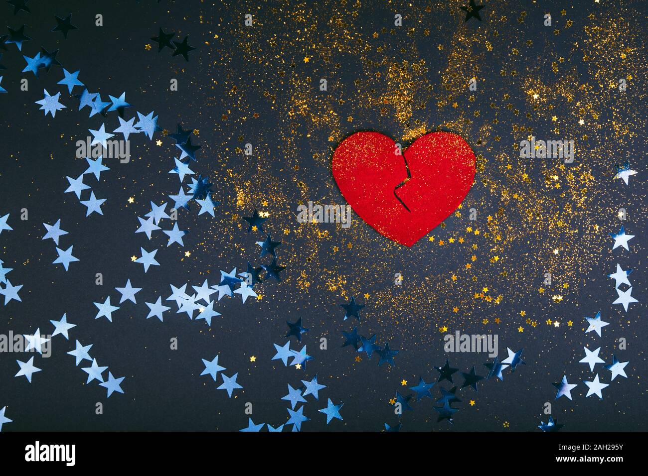 Heart broken on black background - love concept Stock Photo - Alamy